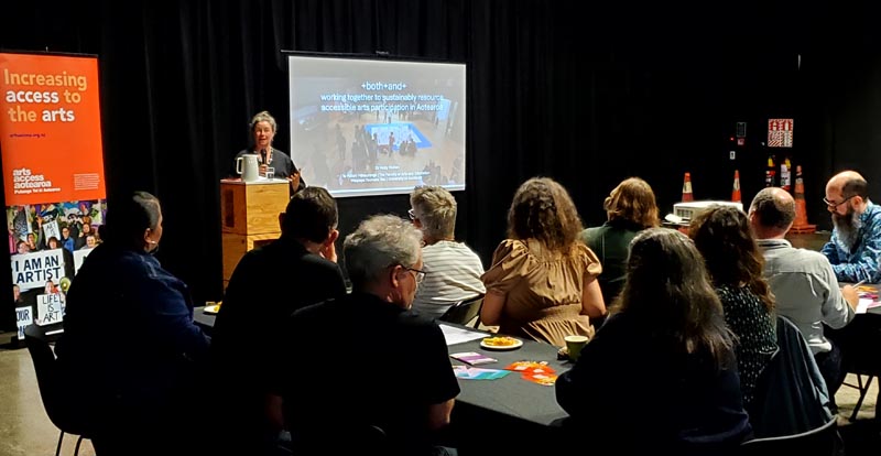 Dr Molly Mullen presents research to seated participants